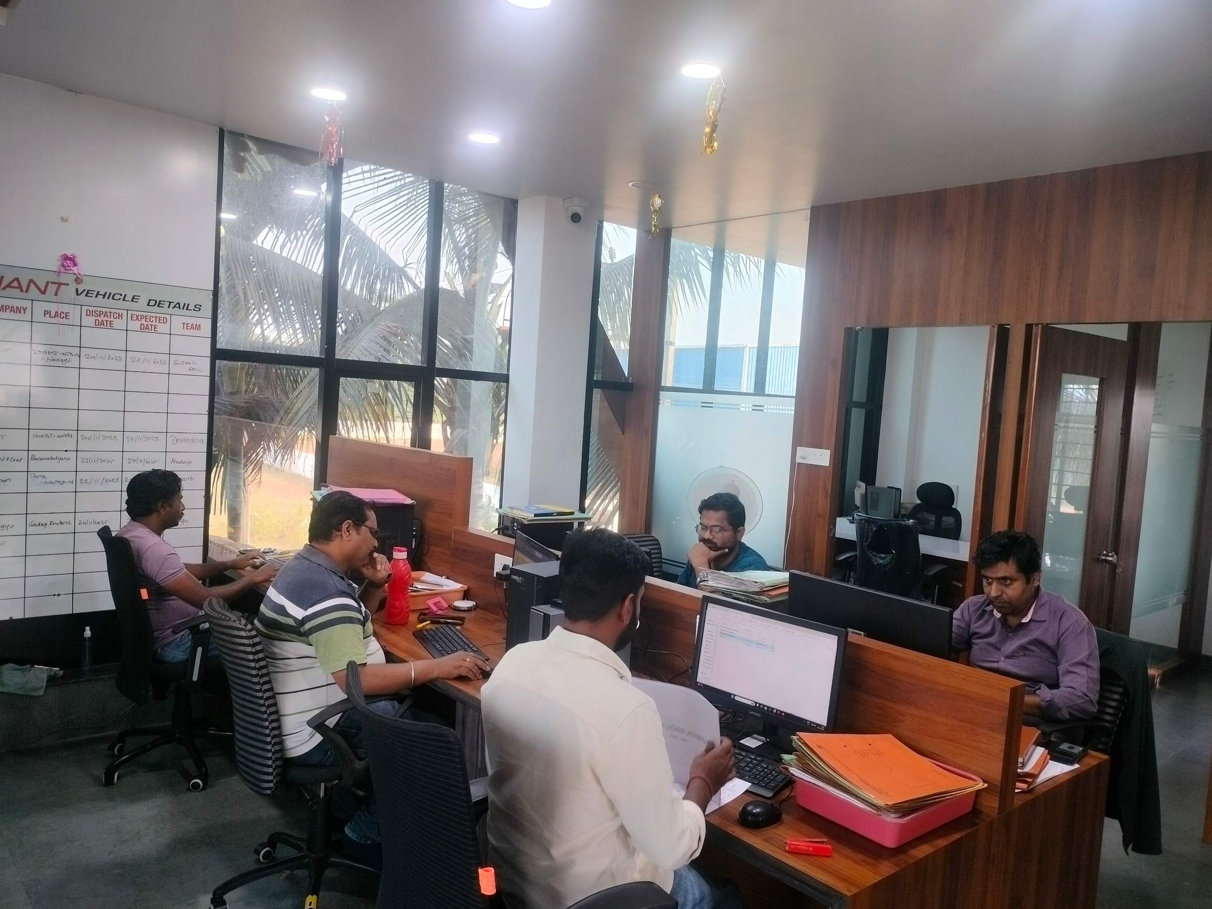 Sushant Group staff working at computers in the Dharwad office