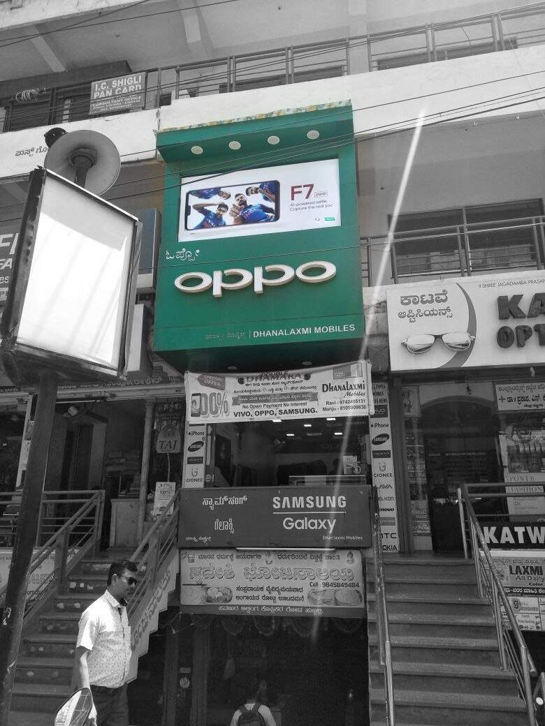 Green OPPO backlit projecting storefront signboard