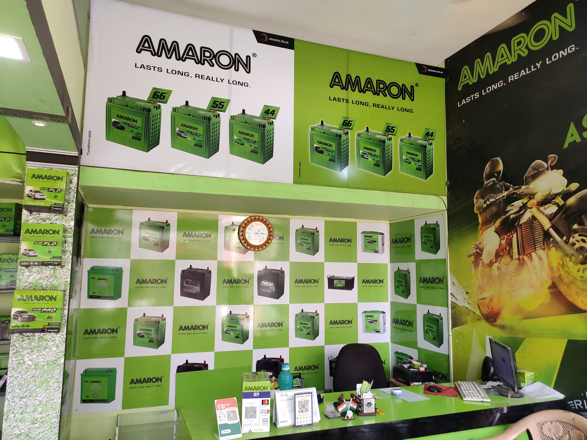 Amaron dealer interior with a branded product wall and counter
