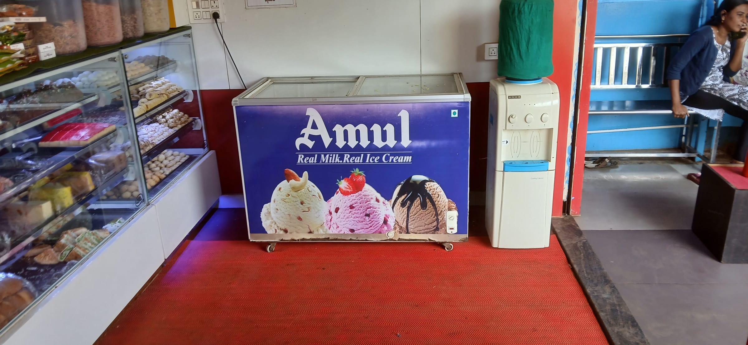 Amul-wrapped freezer inside a parlour