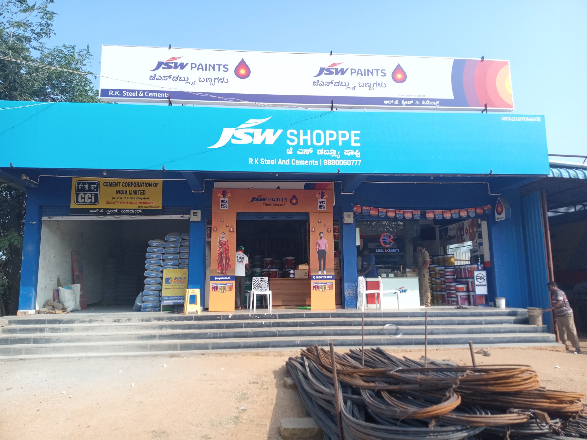 A full dealer shopfront in the brand's blue fascia