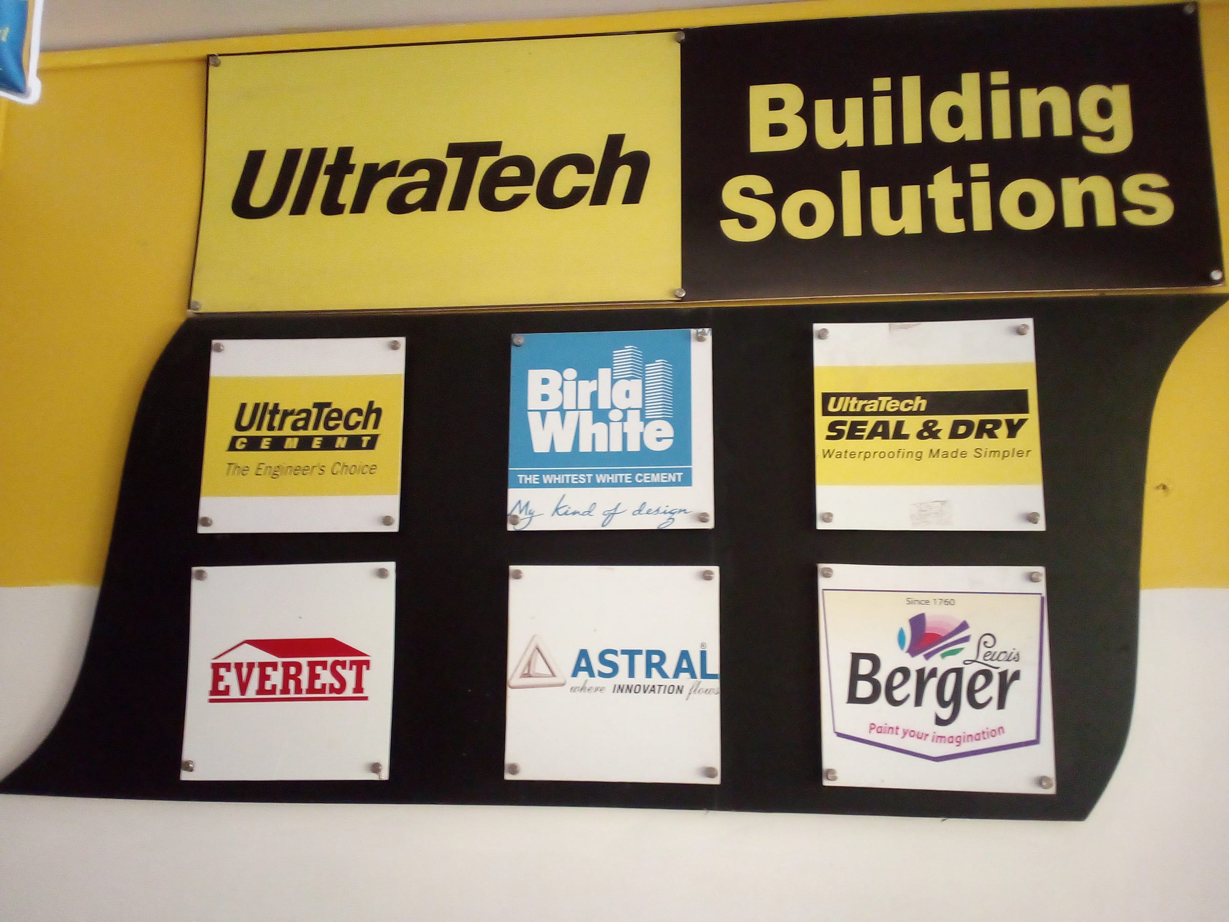UltraTech Building Solutions brand wall with partner product panels